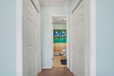 This 3-bedroom, 2-bathroom condo features a bright living room - photo 12