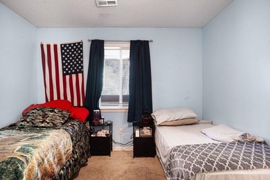 This 3-bedroom, 2-bathroom condo features a bright living room - photo 14