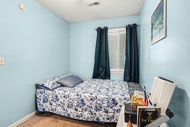 This 3-bedroom, 2-bathroom condo features a bright living room - photo 16