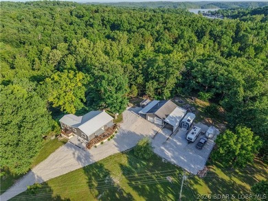 New price on this Lake area retreat on 3 acres with garage/RV - photo 3