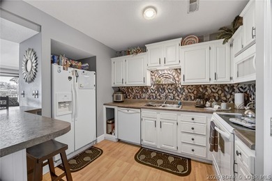 MOTIVATED SELLER! Top-floor views and lake life at its best - photo 8