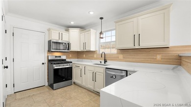 Experience lake living at its best in this beautifully updated - photo 3