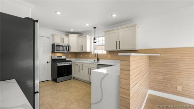 Experience lake living at its best in this beautifully updated - photo 4