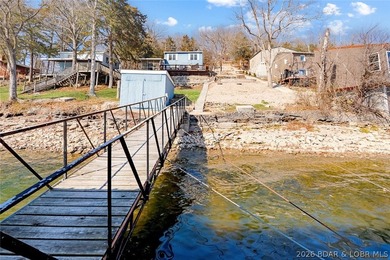 Tucked along the shoreline in year-round deep water, this - photo 4