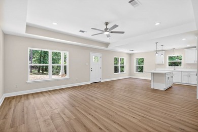CUTE AS A BUTTON COTTAGE STYLE WATERFRONT home with large front - photo 4