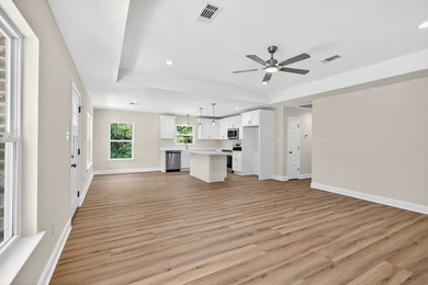 CUTE AS A BUTTON COTTAGE STYLE WATERFRONT home with large front - photo 8