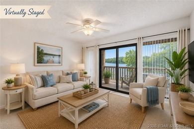AFFORDABLE LAKEFRONT, Low HOA fees, 1 bedroom, 1 bath end-unit - photo 1