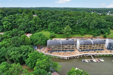 AFFORDABLE LAKEFRONT, Low HOA fees, 1 bedroom, 1 bath end-unit - photo 6