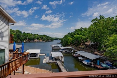 Lake living doesn't get much better than this! Nestled in a - photo 1