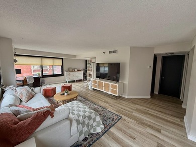 This bright and generously sized corner unit offers an open - photo 1