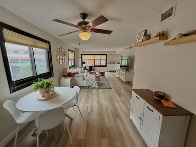 This bright and generously sized corner unit offers an open - photo 2