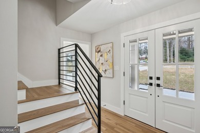 Stylish, low-maintenance Brookhaven living inside gated Ashford - photo 3