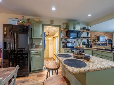 Located in the waterfront community of Kerr Shores, this - photo 14