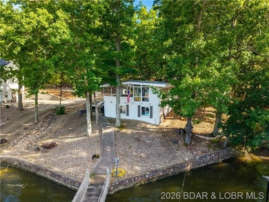 Sitting on a gentle lot in a beautiful cove location, this gem - photo 2
