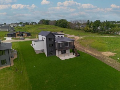 Nestled on a picturesque 1.31-acre lot in northeast Rochester