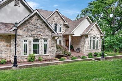 Nestled on a beautifully landscaped 1.3+ acre lot in the - photo 2