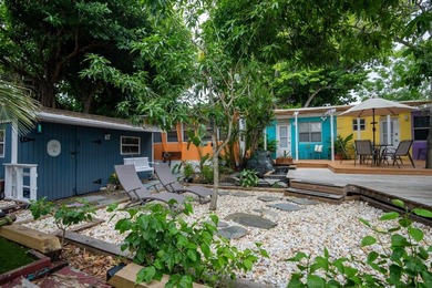 Only two blocks from the beach, this well established resort and - photo 1