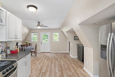Perched atop a scenic hill with breathtaking water views, this - photo 11