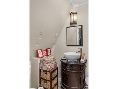 Perched atop a scenic hill with breathtaking water views, this - photo 16