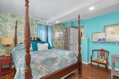 Perched atop a scenic hill with breathtaking water views, this - photo 18