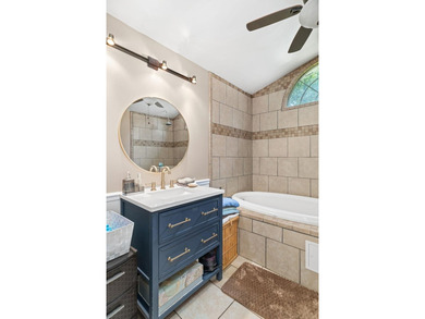 Perched atop a scenic hill with breathtaking water views, this - photo 19