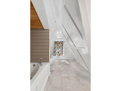 Perched atop a scenic hill with breathtaking water views, this - photo 25