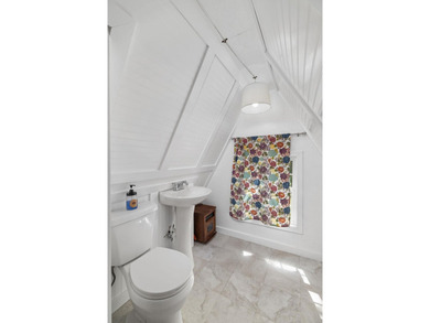 Perched atop a scenic hill with breathtaking water views, this - photo 26