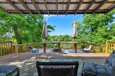 Perched atop a scenic hill with breathtaking water views, this - photo 27