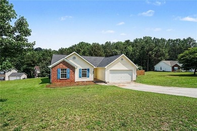 Welcome home to this inviting 3-bedroom, 2-bath ranch nestled in - photo 2