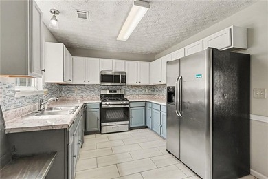 Welcome home to this inviting 3-bedroom, 2-bath ranch nestled in - photo 6