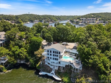 Perched above the shimmering waters of the Lake of the Ozarks - photo 3