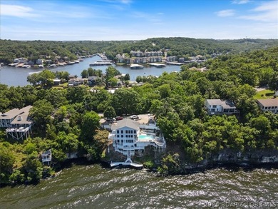 Perched above the shimmering waters of the Lake of the Ozarks - photo 4