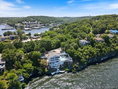 Perched above the shimmering waters of the Lake of the Ozarks - photo 5