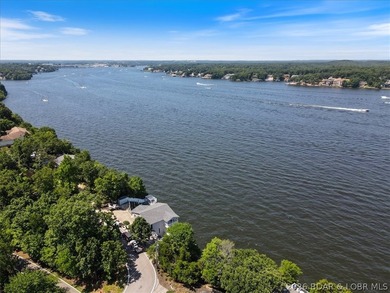 Perched above the shimmering waters of the Lake of the Ozarks - photo 6