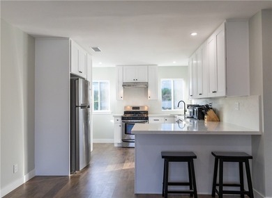 Welcome to this beautifully refreshed home located in the - photo 2