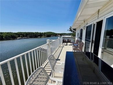 Lake life just got a serious glow-up! This beautifully remodeled - photo 2