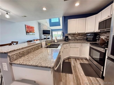 Lake life just got a serious glow-up! This beautifully remodeled - photo 6