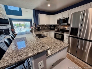 Lake life just got a serious glow-up! This beautifully remodeled - photo 7