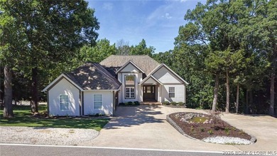 Located on a quiet cul-de-sac w/seasonal lake view in the highly - photo 1