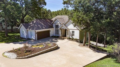 Located on a quiet cul-de-sac w/seasonal lake view in the highly - photo 2