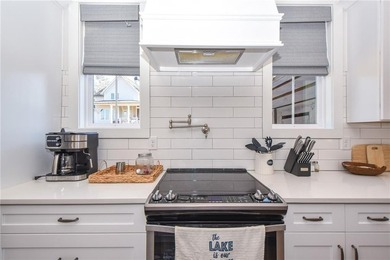 Experience refined lake living at this beautifully designed - photo 29