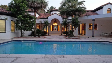 Set on one of Coral Gables finest tree-lined streets, this - photo 1