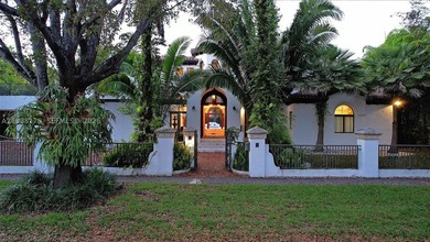 Set on one of Coral Gables finest tree-lined streets, this - photo 3