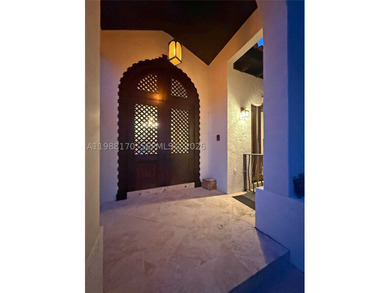 Set on one of Coral Gables finest tree-lined streets, this - photo 5