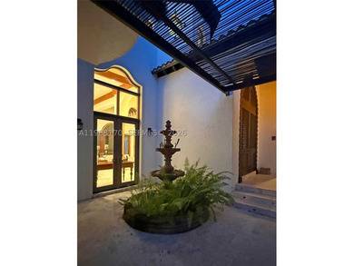 Set on one of Coral Gables finest tree-lined streets, this - photo 6