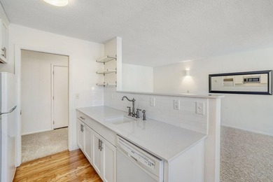 Move right into this top-floor, one-level home offering - photo 1