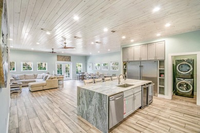 Discover this coastal luxury and pristine 2019-built, 7-bedroom - photo 1