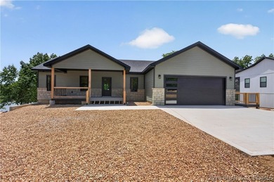 Stunning new-construction waterfront home at the Lake of the - photo 1