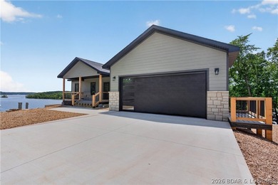 Stunning new-construction waterfront home at the Lake of the - photo 2