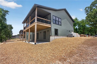 Stunning new-construction waterfront home at the Lake of the - photo 8